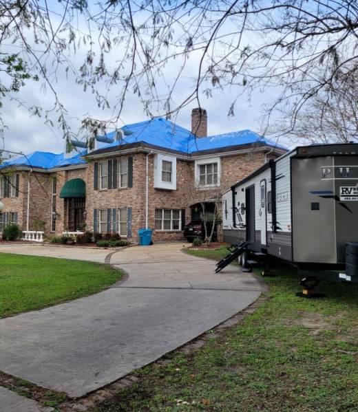 RV with Tarped Roof House